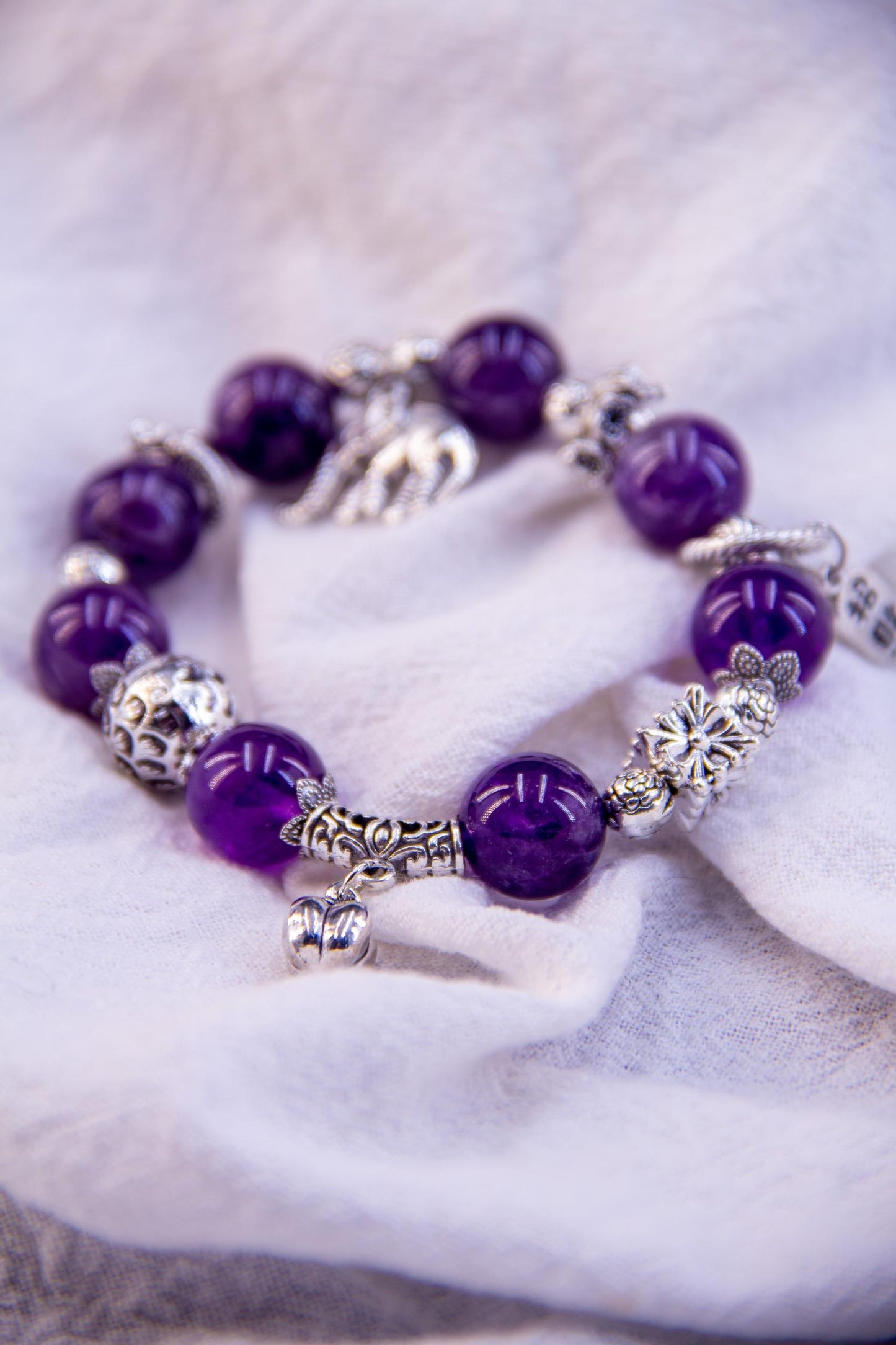 Amethyst Charm Bracelet - A Blend of Elegance and Symbolism