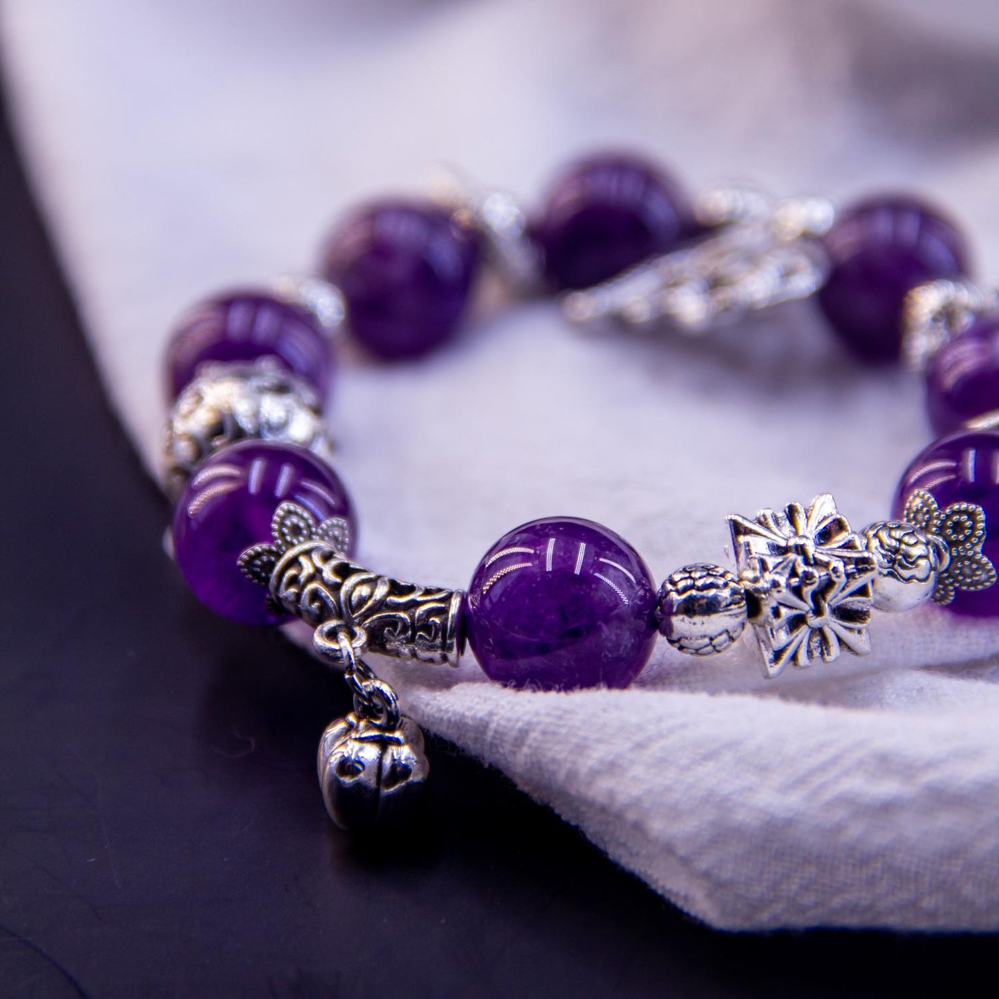 Amethyst Charm Bracelet - A Blend of Elegance and Symbolism